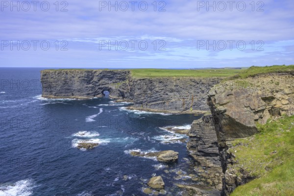 Cliff coast with rock arch, Kilkee, County Clare, Ireland