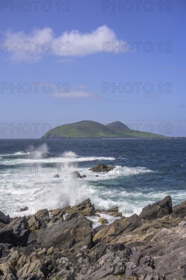 Waves blaze against cliff coast in the background Great Blasket Island, Dunurlin, Kerry, Ireland