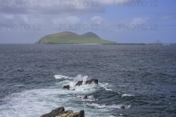 Waves blaze against rocks in the background Great Blasket Island, Blasket Center Viewing Platform, Dunurlin, Kerry, Ireland