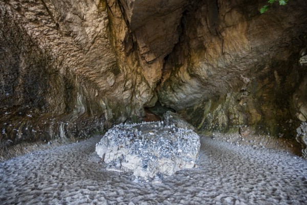 Stone men in a rock cave on the beach at Cala Luna, Golfo di Orosei, Baunei, Sardinia, Italy