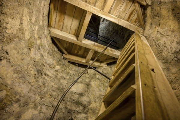 Climb over narrow wooden stairs in the round tower, St. Canice's Cathedral, Kilkenny, County Kilkenny, Ireland