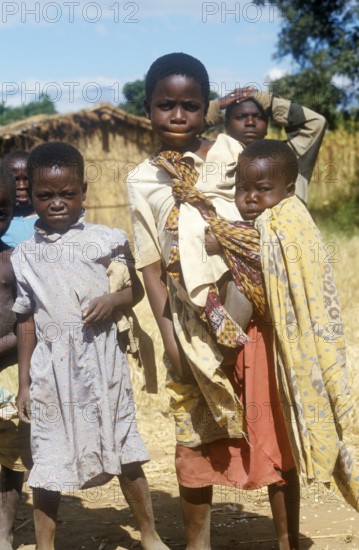 Children posing for the camera on the side of the road, Bwangu Mzimba, Malawi, Africa, June 2000, vintage, retro, old, historical