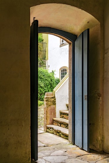 Door in a historic colonial-style mansion overlooking the house's inner courtyard in Ouro Preto