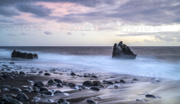 Sunset, waves and rocks in the sea, Praia Formosa, Madeira, Portugal