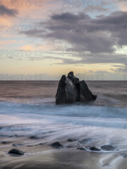 Sunset, waves and rocks in the sea, Praia Formosa, Madeira, Portugal