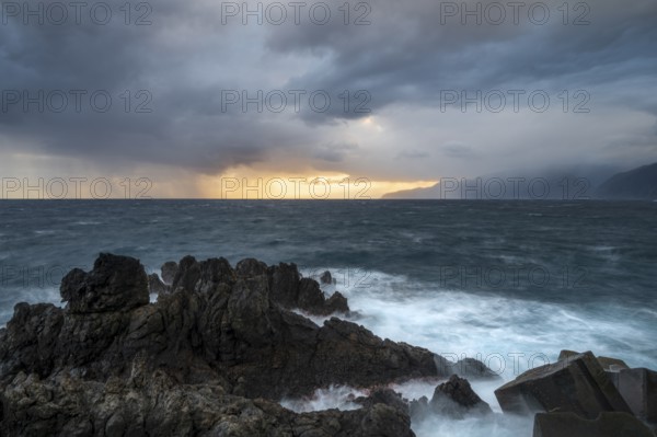 Sunrise, waves and rocks, coast near Porto Moniz, Madeira, Portugal