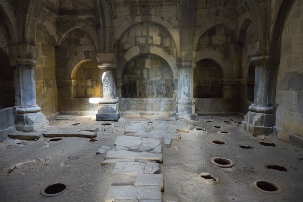 Arched stone interior with floor openings and atmospheric lighting through ancient arches, Haghpat Monastery, Haghpatavank, Haghpat Town, UNESCO World Heritage Site, Lorikeet Province, Armenia