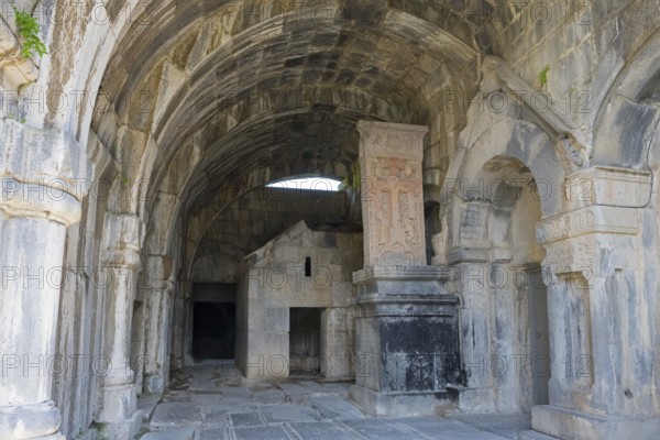 Vaulted stone building with decorated arches and historic reliefs in old walls, Haghpat monastery, Haghpatavank, town of Haghpat, UNESCO World Heritage Site, Lorikeet province, Armenia