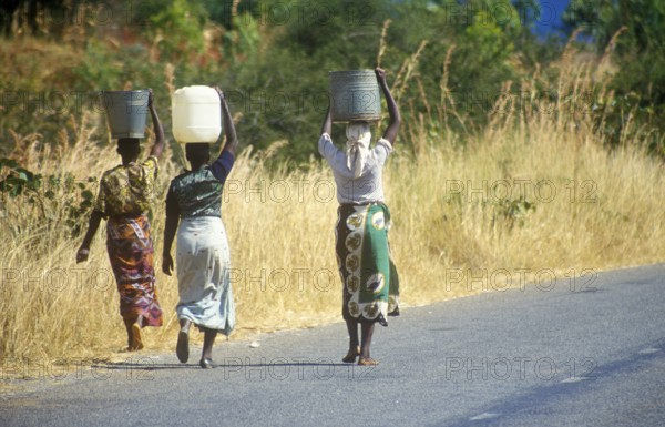 Women balancing baskets on their heads, Bwangu Mzimba, Malawi, Africa, June 2000, vintage, retro, old, historic