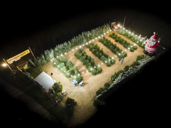In a Christmas tree centre near Frankfurt am Main there is a decorative inflatable figure of Father Christmas several metres high. (Aerial photo taken with a drone), Frankfurt am Main, Hesse, Germany
