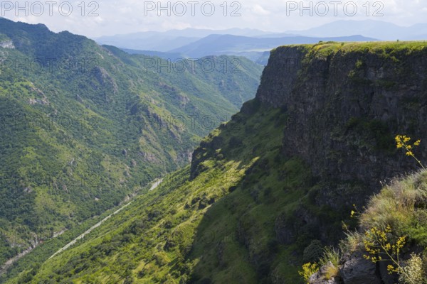 Gorge with lush vegetation and steep cliffs under blue sky in peaceful surroundings, landscape near Odsun, Odzun, Debed gorge, Lorikeet province, Armenia