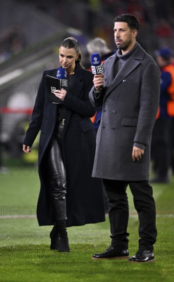 DAZN presenter Laura Wontorra in leather outfit and TV expert Sami Khedira with microphone, logo, Champions League, Allianz Arena, Munich, Bavaria, Germany
