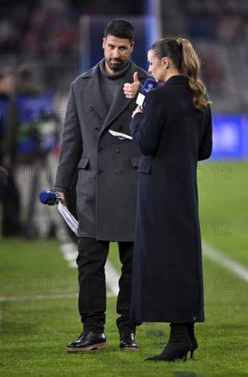 DAZN presenter Laura Wontorra and TV expert Sami Khedira with microphone, logo, gesture gesture thumbs up, Champions League, Allianz Arena, Munich, Bavaria, Germany