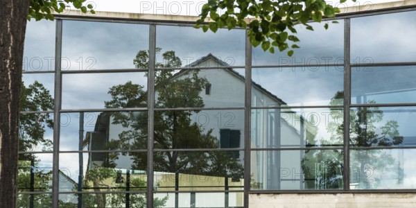 House is reflected in glass faÃ§ade, architecture, reflection