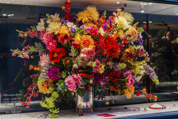Huge colorful bouquet of flowers in shop window, decoration