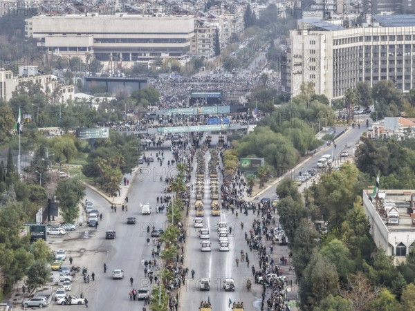 Damascus, Syria â€“ December 08, 2025: Top view of a military parade by Syrian army units marking the first anniversary of liberation and the change of Assad's regime, held in Umayyad Square in central Damascus and attended by thousands of people, Damascus, Damascus, Syria
