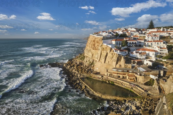 Scenic view of the seaside Azenhas do Mar fishing village on cliff on Atlantic ocean coast, Portugal