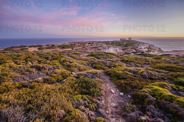 Cabo Espichel cape Espichel on Atlantic ocean at sunset with ruins