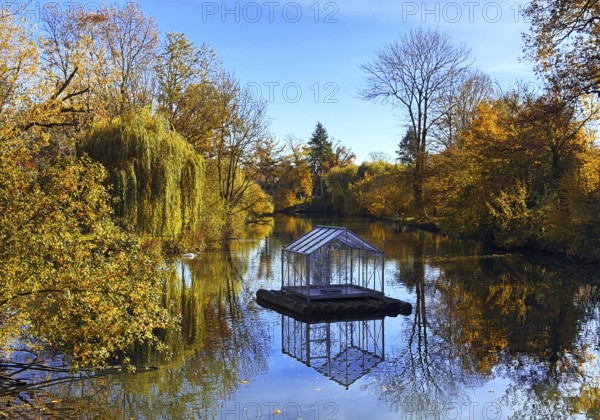 The river Lippe in GrÃ¼nen Winkel with the artwork Arche by Christoph Hildebrand, Lichtpromenade Lippstadt, North Rhine-Westphalia, Germany