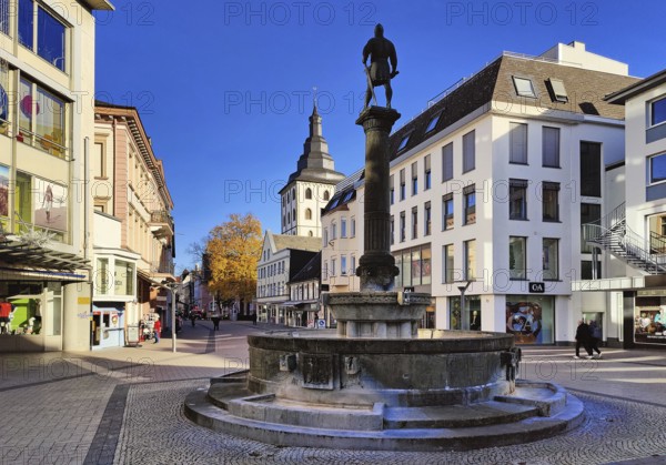 Bernard II monument by Albert Pehle on the Bernard Fountain, with the tower of St. James Church in the background, Lippstadt, North Rhine-Westphalia, Germany
