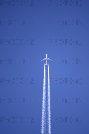 Airplane with contrails, Germany