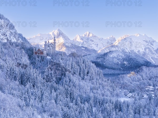 View of Neuschwanstein Castle in a vast, snowy mountain landscape. Impressive winter panorama, Schwangau near FÃ¼ssen, OstallgÃ¤u, AllgÃ¤u, Bavaria, Germany