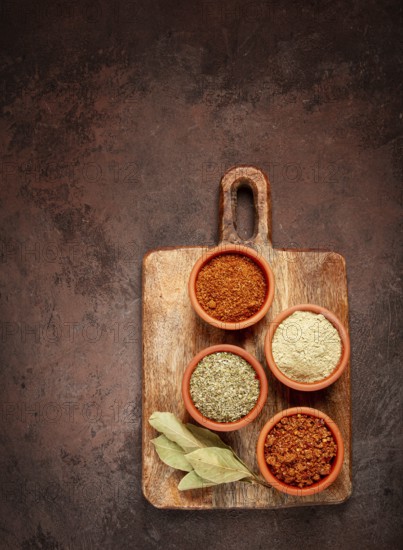Georgian spices, in ceramic bowls, assortment, set of spices, utsho, adjika, Svan salt, ground coriander, top view, no people