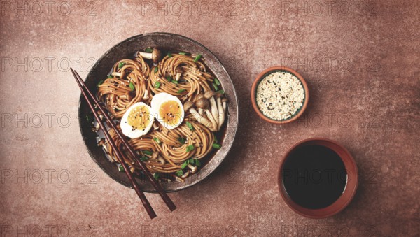 Buckwheat noodles, soba, with shimeji mushrooms, boiled egg, green onion, sesame seeds, homemade, no people