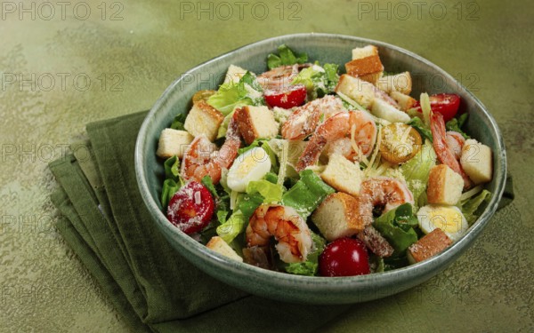 Caesar salad, with tiger prawns, shrimp salad, lettuce, quail eggs, cherry tomatoes, parmesan cheese, no people