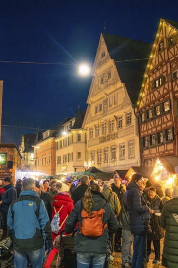 Evening Christmas market with illuminated half-timbered houses and crowd of people in the center, Christmas market 2025, Nagold, Black Forest, Calw district, Germany