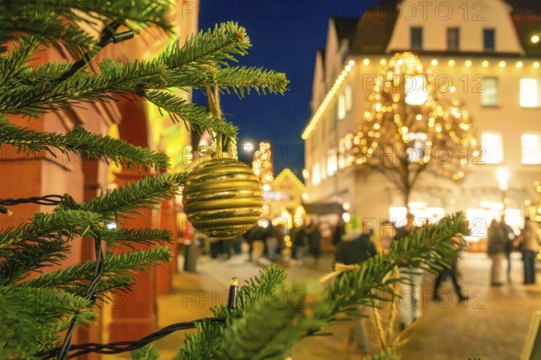 Christmas market lighting in an urban environment with tree balls in the foreground, Christmas market 2025, Nagold, Black Forest, Calw district, Germany