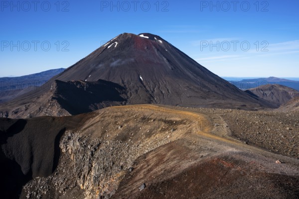 Mount Ngauruhoe and the Tongariro Alpine Crossing hiking trail in Tongariro National Park. North Island, New Zealand