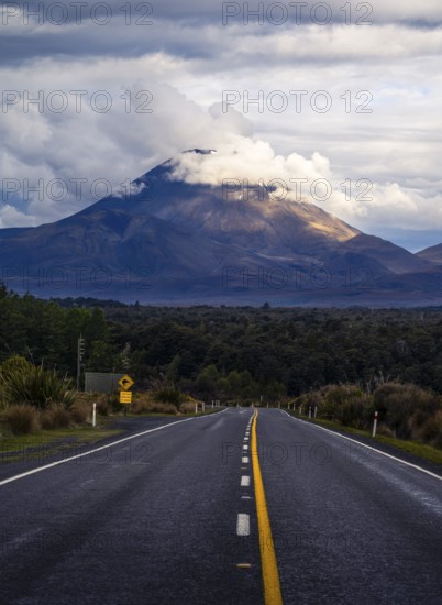 Roadshot, Mount Ngauruhoe evening at sunset, road SH 47. Tongariro National Park, North Island, New Zealand