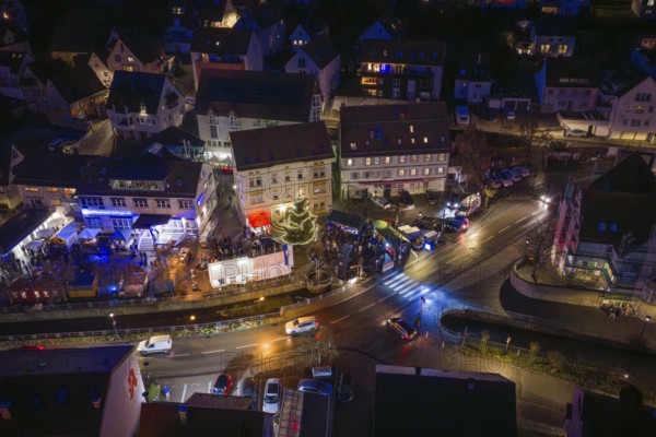 Night view of a lively village with illuminated road junctions, Aidlingen Christmas market, Böblingen district, Germany
