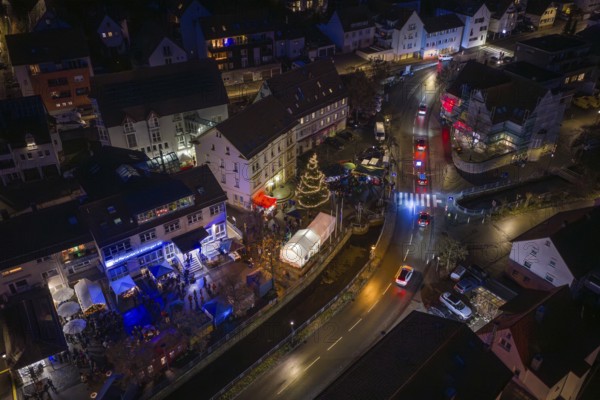 Aerial view of a village at night with lights and Christmas tree, Aidlingen Christmas market, BÃ¶blingen district, Germany