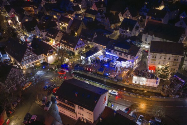 Aerial view of an illuminated village at night with decorated streets, Aidlingen Christmas market, BÃ¶blingen district, Germany
