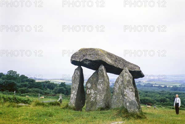 Pentre Ifan prehistoric Neolithic burial chamber, Crymych, Nevern, Pembrokeshire, Wales, UK 9 July 1971 man standing giving scale