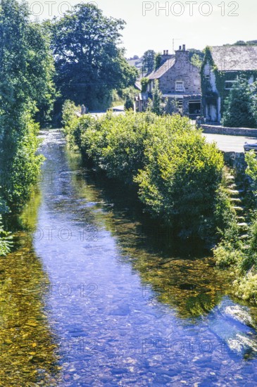 River Nevern and village with Trewern Arms hotel pub, Nevern, Pembrokeshire, Wales, UK 17 July 1971