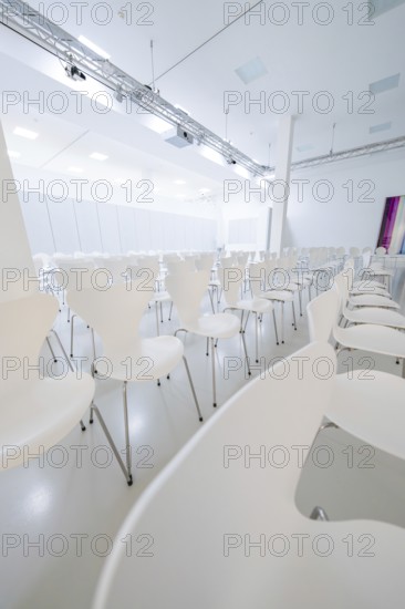 Modern, empty conference room with white chairs in minimalist design, Open Horizons exhibition, Schauwerk Sindelfingen, BÃ¶blingen district, Germany