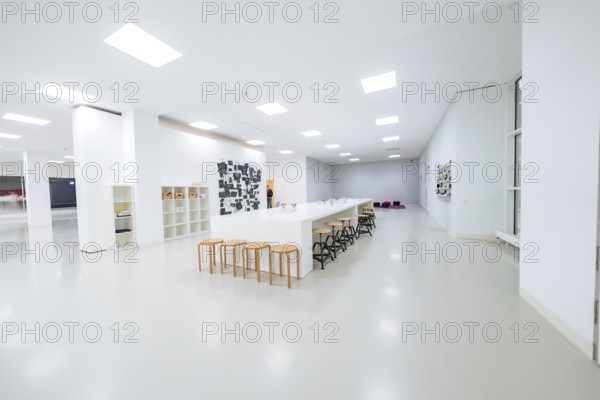 Large, bright room with long tables and chairs, minimalistic modern furniture, Open Horizons exhibition, Schauwerk Sindelfingen, Böblingen district, Germany