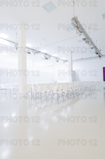 Minimalistic hall with rows of white chairs and bright light sources, Open Horizons exhibition, Schauwerk Sindelfingen, BÃ¶blingen district, Germany