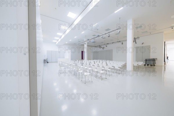 Large, empty hall with lots of white chairs in a minimalistic, bright setting, Open Horizons exhibition, Schauwerk Sindelfingen, BÃ¶blingen district, Germany