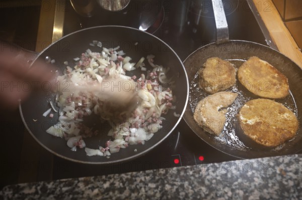 Preparation of breaded cutlets of giant bovista (Bovista) in the pan, Mecklenburg-Vorpommern, Germany