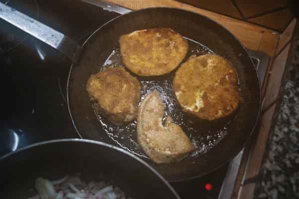 Breaded schnitzel of giant bovista (Bovista) in a pan, Mecklenburg-Vorpommern, Germany