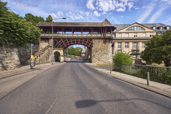 City fortification, historic city wall Heidenmauer, historicizing city gate Römertor, barrier bollard, street, lantern, trees, bushes, blue sky, cirrus clouds, CoulinstraÃŸe, Wiesbaden, state capital, district-free city, Hesse, Germany