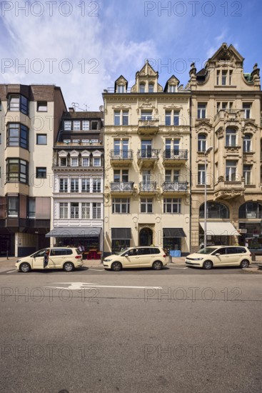 Row of houses, general architecture, modern buildings, historic buildings, residential buildings and commercial buildings, taxi stand, taxi, retail stores, modern versus historical architecture, contrast, blue sky, overcast sky, cirrostratus clouds, cumulus clouds, Kranzplatz street, Wiesbaden, state capital, district-free city, Hesse, Germany