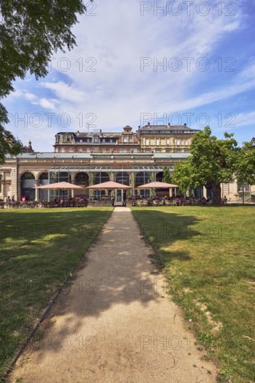 Café, system catering, Cafe Del Sol, historic building, hall, colonnades, parks, trees, lawn, paths, blue sky, cumulus clouds, cirrus clouds, Kochbrunnenplatz, Wiesbaden, state capital, district-free city, Hesse, Germany