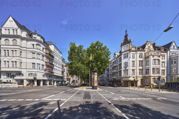 Historic residential buildings, general architecture, central island, advertising column, trees, blue sky, altocumulus clouds, Kaiser-Friedrich-Ring intersection with Bismarckring and Dotzheimer StraÃŸe, federal road B54, Wiesbaden, state capital, district-free city, Hesse, Germany