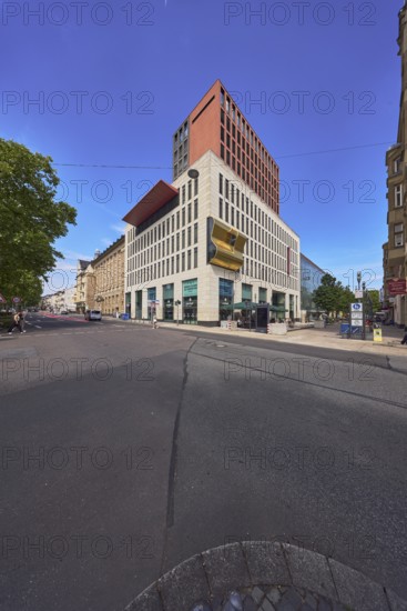 LuisenForum, shopping center, modern architecture, residential and commercial buildings, pedestrian zone, trees, pedestrians as accessories, roads, blue sky, cumulus clouds, intersection of RheinstraÃŸe, Kirchgasse and MoritzstraÃŸe, Wiesbaden, state capital, district-free city, Hesse, Germany