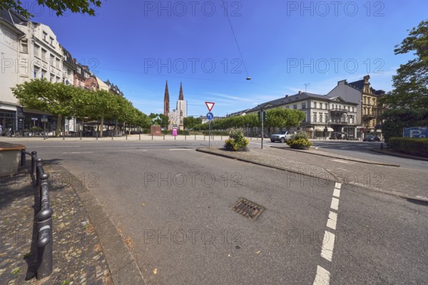 Pedestrian crossing, barrier bollard, traffic island, general architecture, St. Boniface Catholic Church, buildings, houses, roads, trees, blue sky, cirrus clouds, intersection of RheinstraÃŸe, AdolfstraÃŸe and Luisenplatz, Wiesbaden, state capital, district-free city, Hesse, Germany